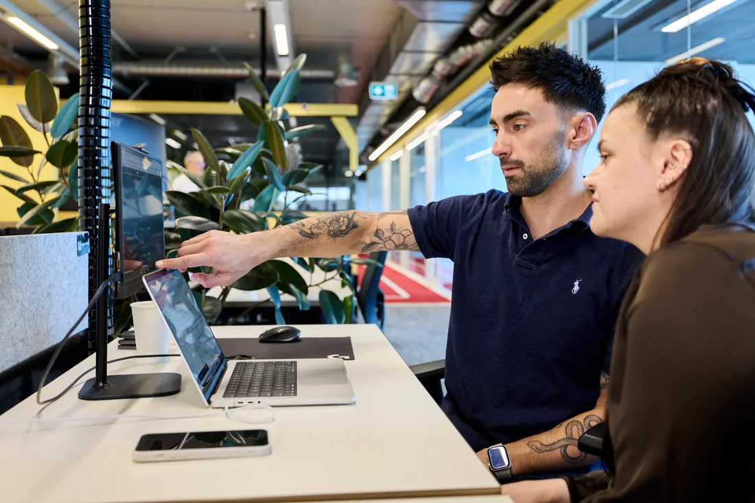 A member of the team reviewing campaign data on a laptop