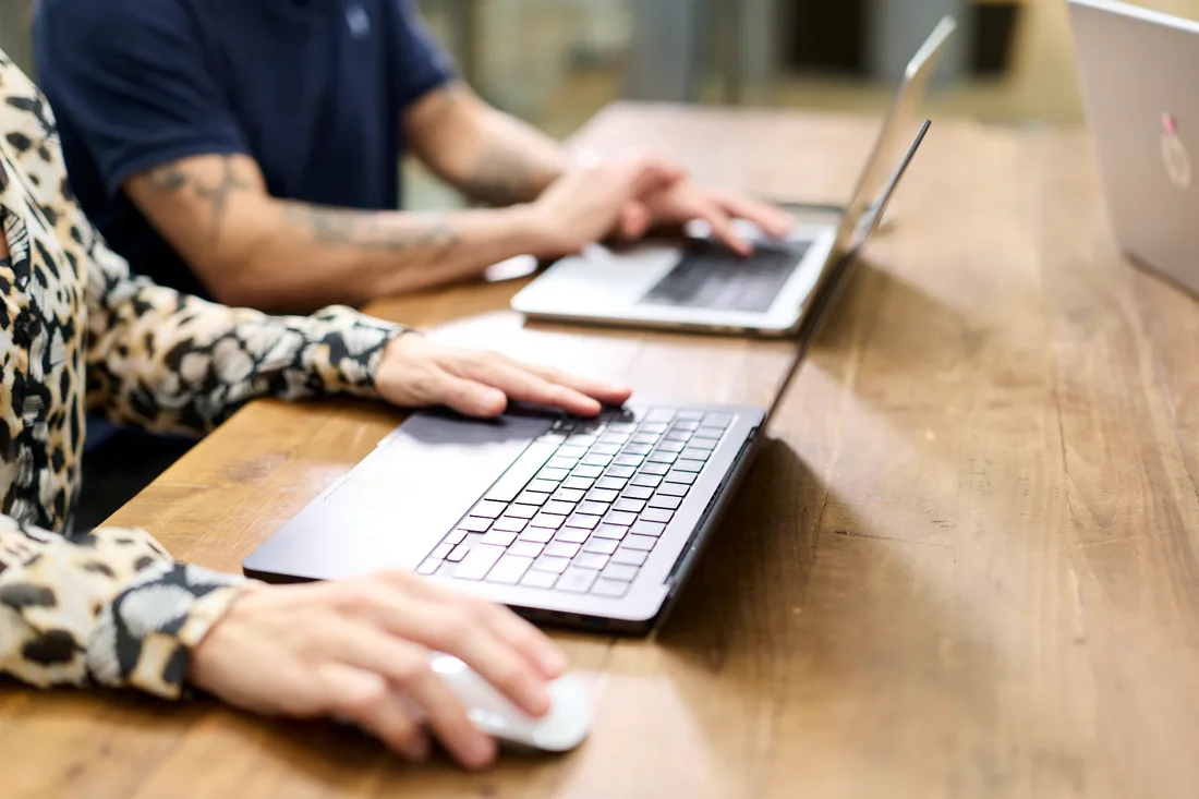 A member of the team working through an account at a laptop