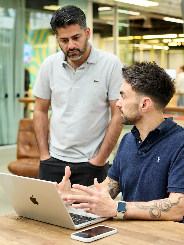 Two of the team reading search and analytics data together
