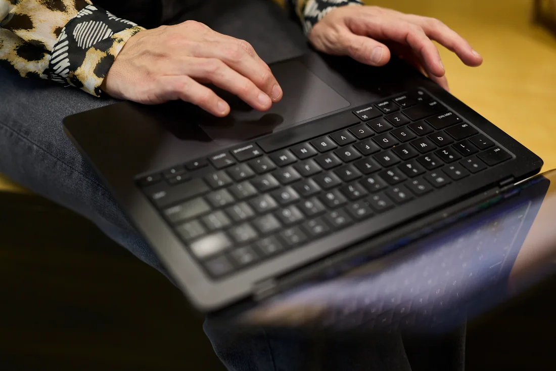 Hands on a laptop keyboard during a site audit