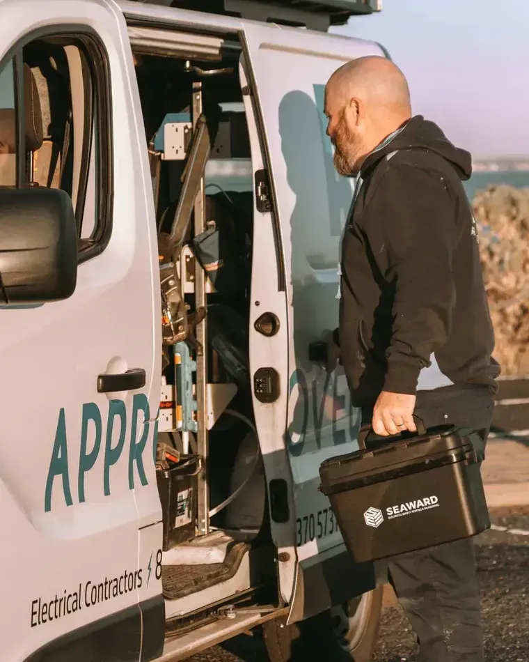 An Approved Electrix electrician at the company van