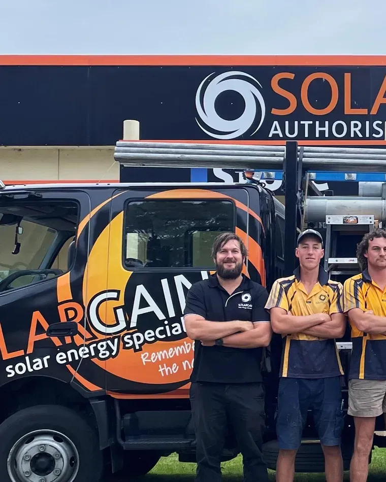 The Solargain team in front of a branded Solargain van